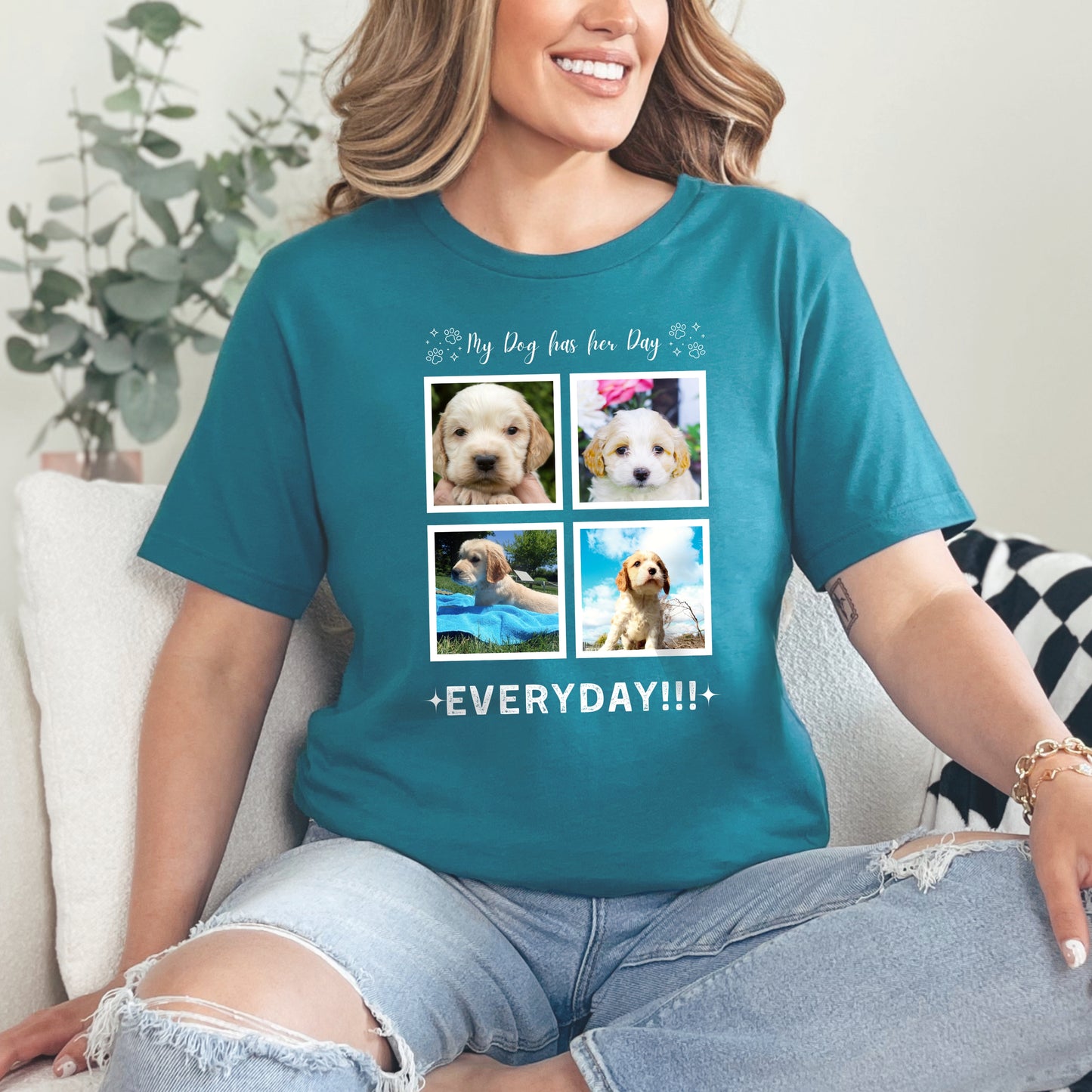 Woman sitting on a sofa wearing a teal Custom Dog Photo t-shirt with 4 photos of her cavoodle. The text is 'My Dog Has her Day, everyday!!!'