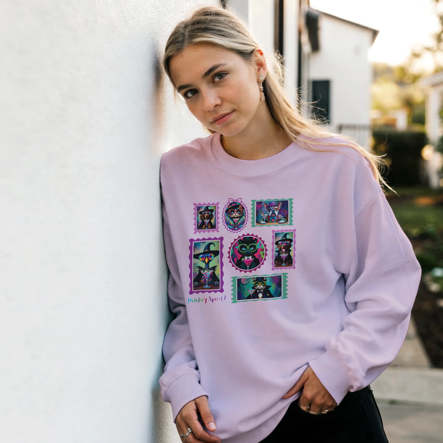 Woman wearing a light pink sweatshirt with Retro Halloween Pets as spooky characters Stamp collage design with outdoor setting.
