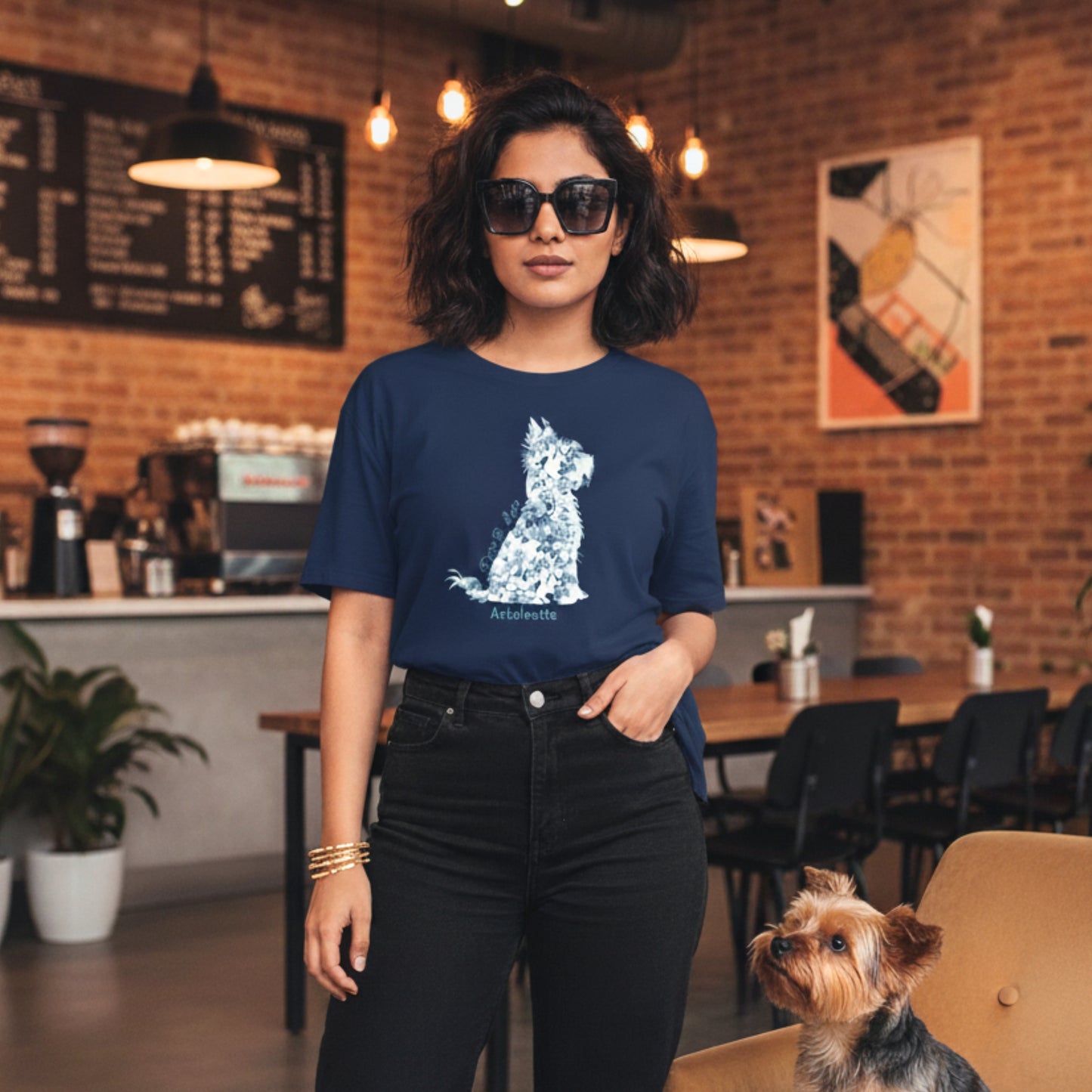 Woman wearing navy Gildan 5000 t-shirt with blue Toile de Jouy Yorkshire Terrier silhouette and “Paws & Love” text; styled for coffee date; spring chic for Melbournian Coffee Culture