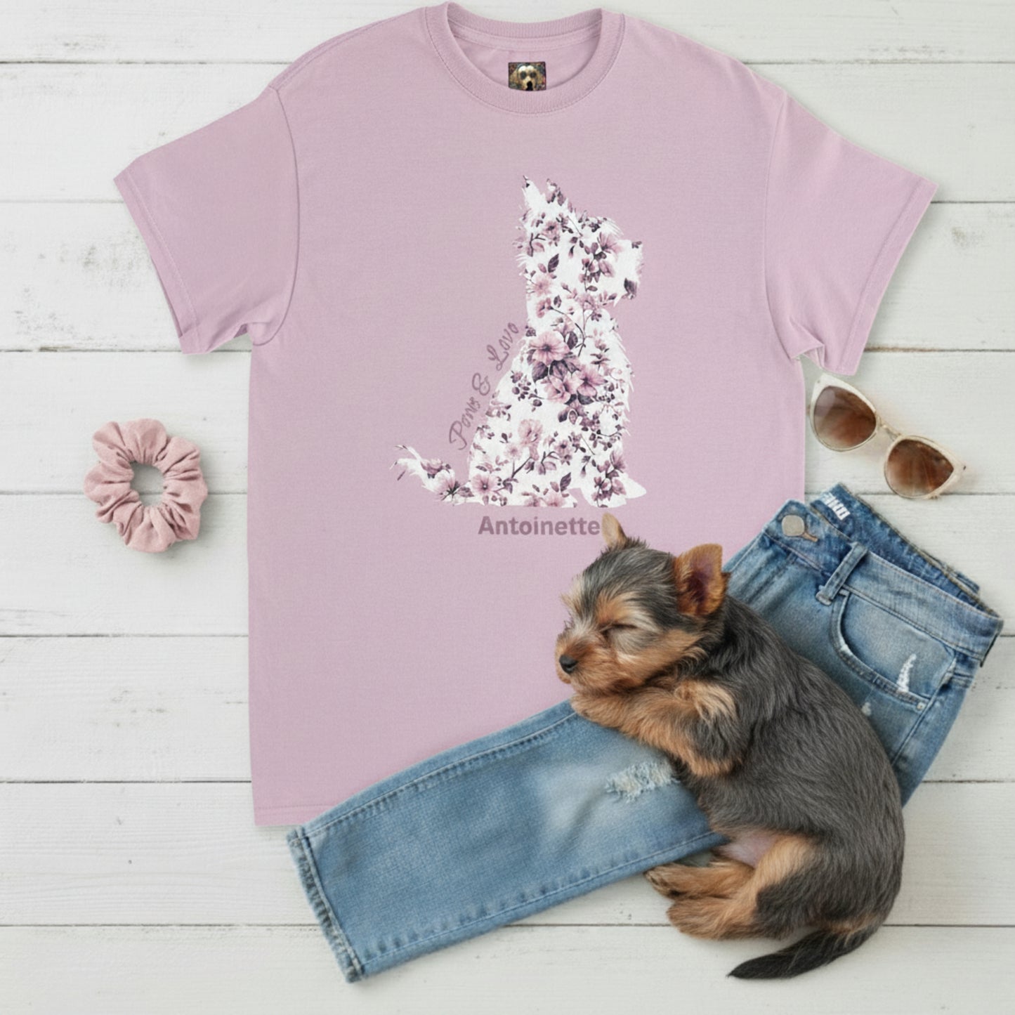 Flat lay of light pink Gildan 5000 t-shirt featuring pink Toile de Jouy Yorkshire Terrier silhouette with “Paws & Love” text; personalised Yorkie lover gift for her.