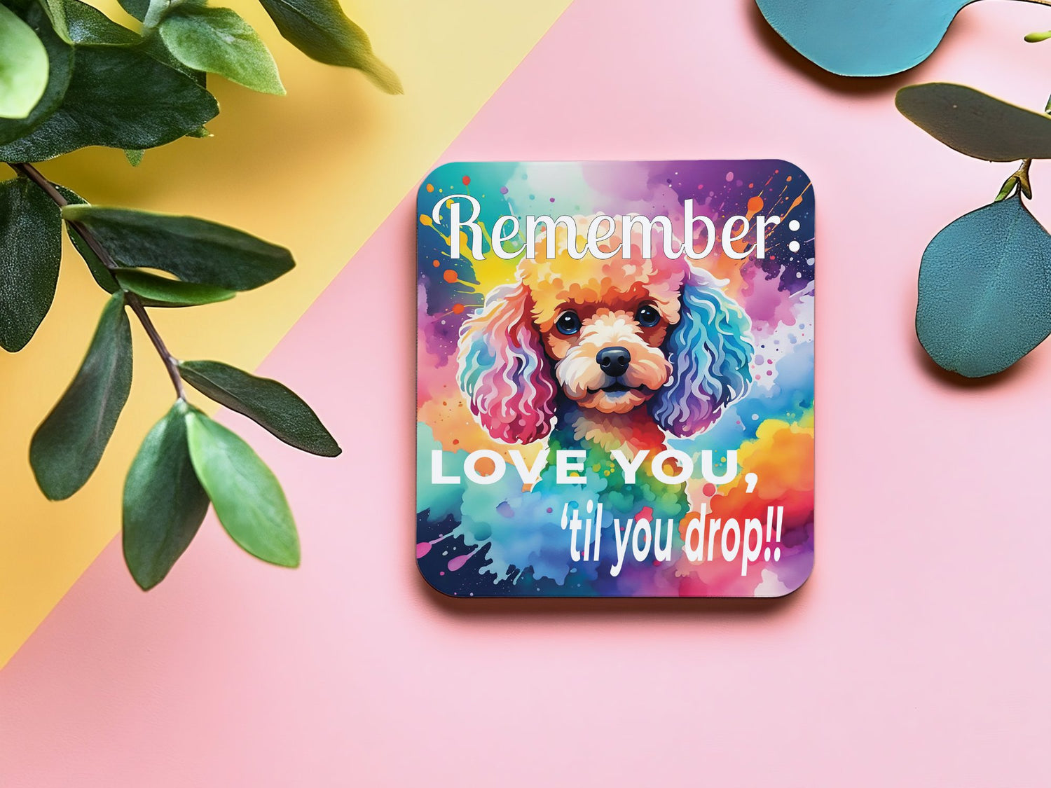 A coaster with a Schnauzer and bright colorful splashes of paint.