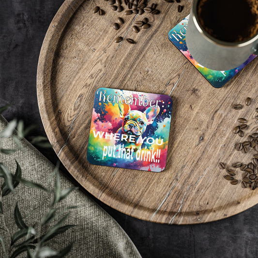 Colorful funny coaster with humorous text and French Bulldog image on a wooden tray with a cup of coffee.