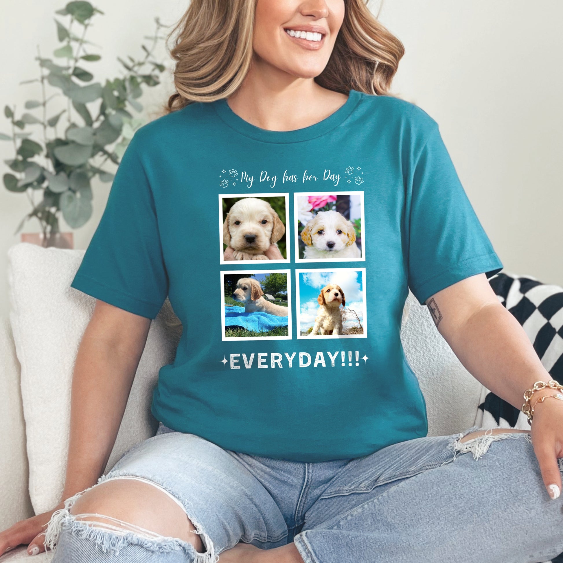 Woman sitting on a sofa wearing a teal Custom Dog Photo t-shirt with 4 photos of her cavoodle. The text is 'My Dog Has her Day, everyday!!!'