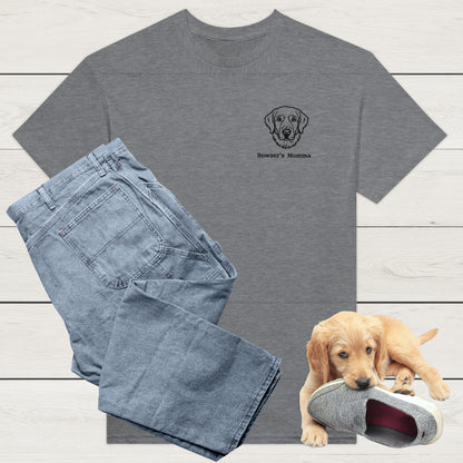 Sport Grey t-shirt with custom embroidery of a dog and personalised text along with wardrobe suggestion of blue jeans on a wooden surface, with a puppy playing with a shoe in the background.