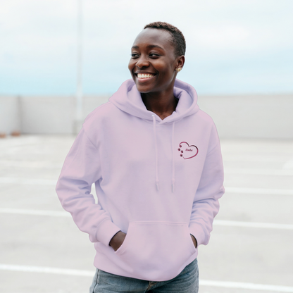 Pink Custom Embroidery, Heart and paw prints embroidered plus Personalized with Pet's Name on a Pullover Hoodie Sweatshirt on woman walking in a parking area