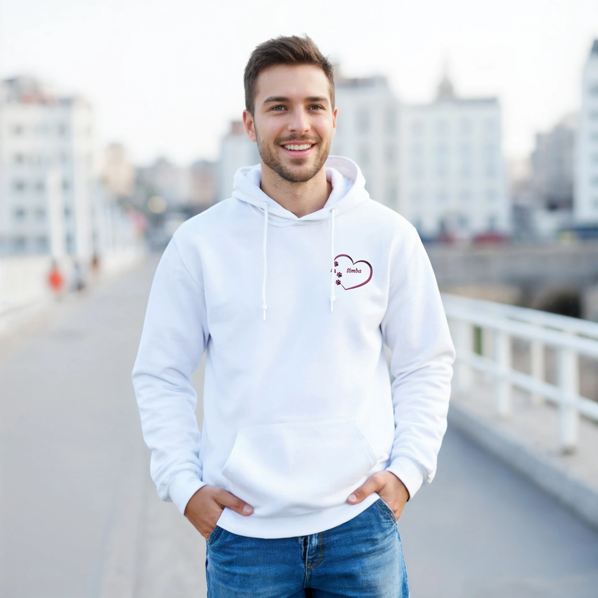  Grey Custom Embroidery, Heart Personalized with Pet's Name on a Pullover Hoodie Sweatshirt on Man walking across a bridge