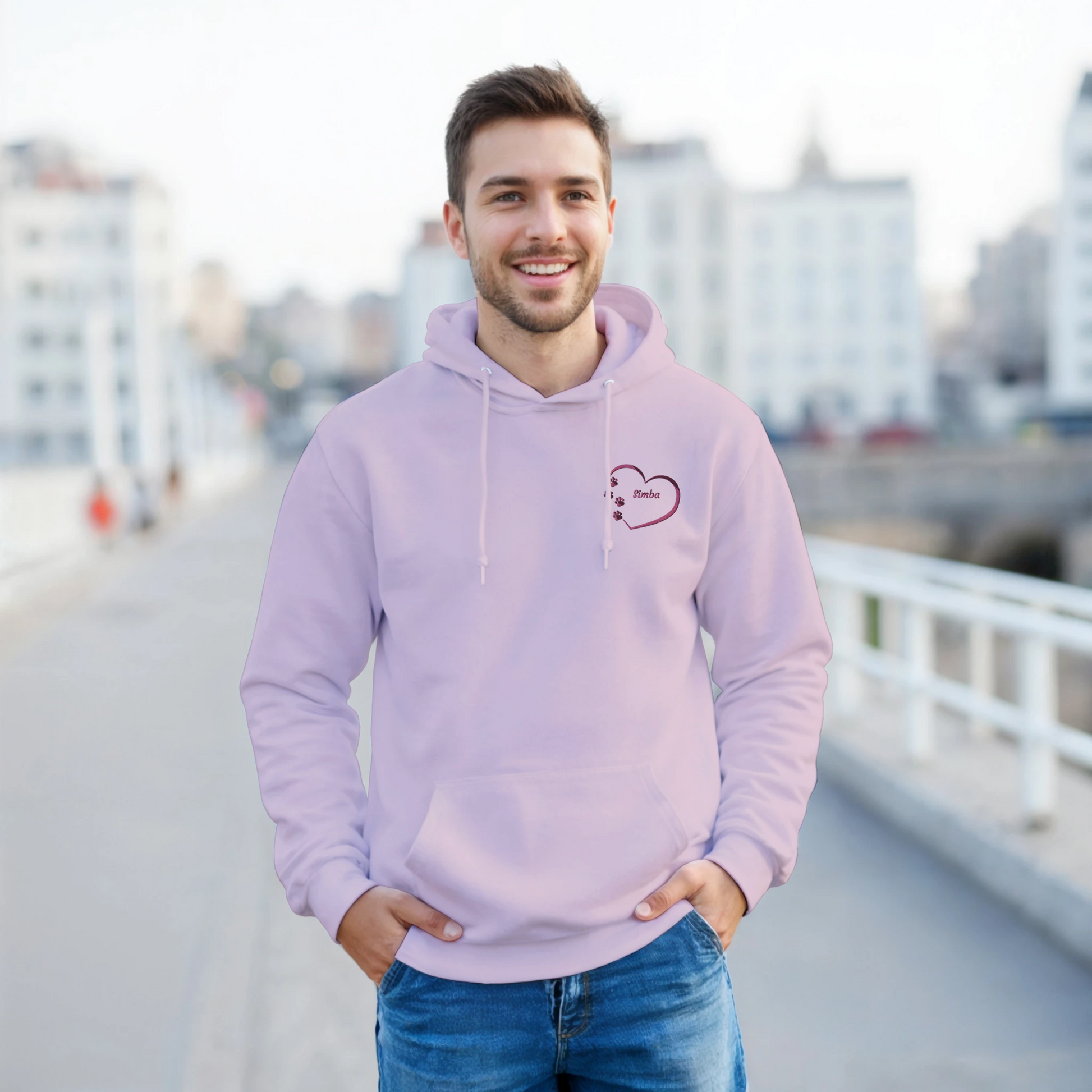  Pink Custom Embroidery, Heart Personalized with Pet's Name on a Pullover Hoodie Sweatshirt on man walking across a bridge.