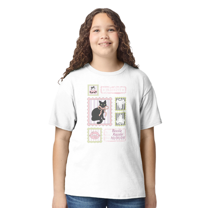 Girl wearing a white t-shirt with a black cat coquette Halloween graphic design on a white background
