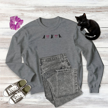 Embroidered Coquette Pink Bows and Black Cats Gildan comfy pullowver crew neck Sweatshirt in sport grey on wooden background with outfit style suggestion and sweet black kitten sleeping.