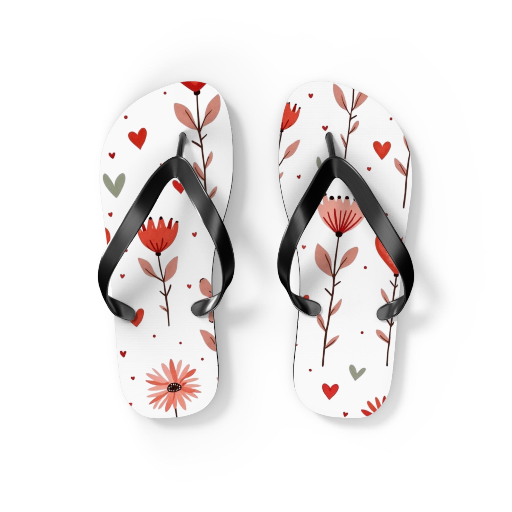 These cushioned Flip Flops have a durable Pink Floral print with hearts. The light weight sandles are shown on a white background.