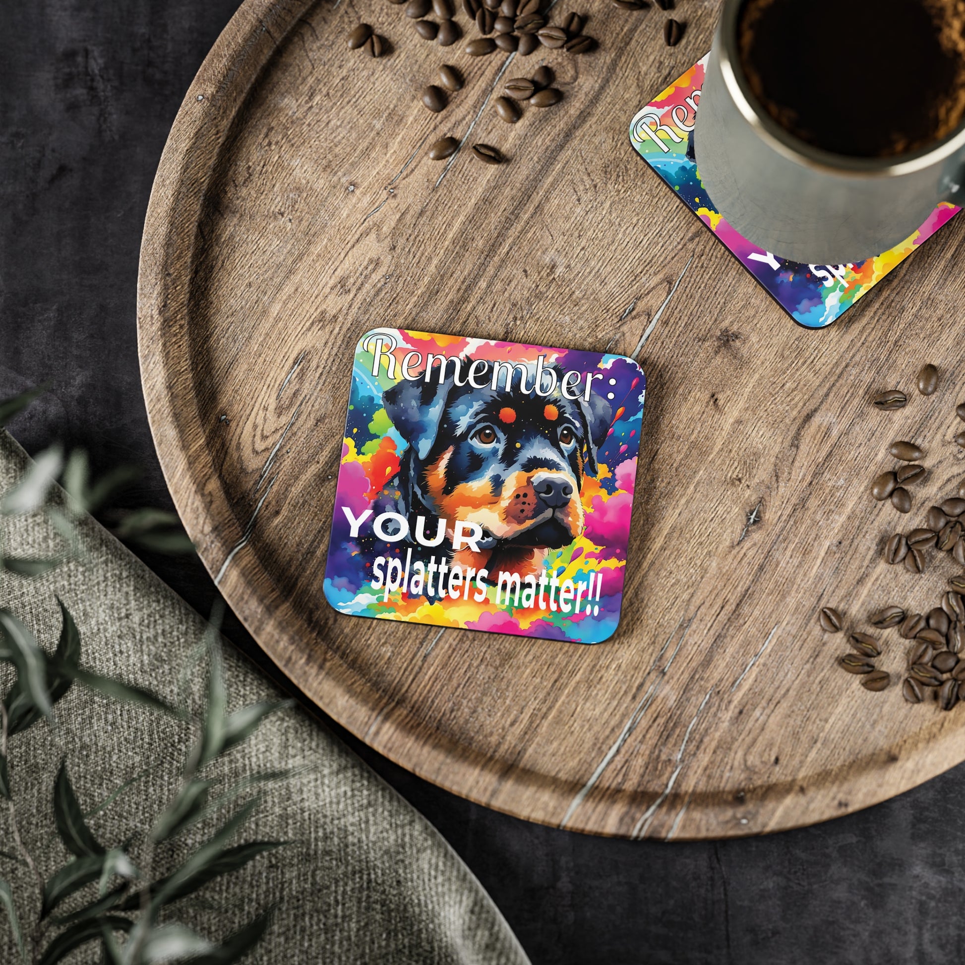 Colorful coaster with a Rotti dog design and text on a wooden tray with cup of  coffee.