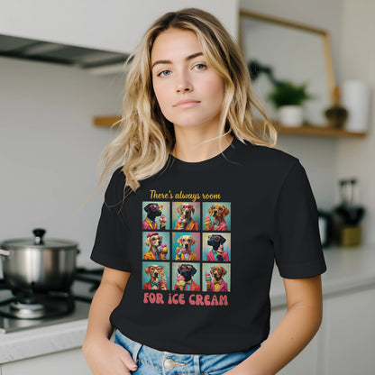 Person wearing a black t-shirt with a colorful graphic and text in a kitchen.
