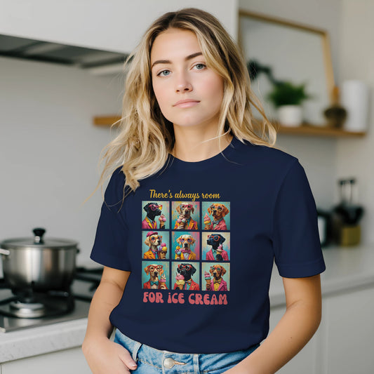 Person wearing a navy blue t-shirt with a colorful graphic and text in a kitchen.