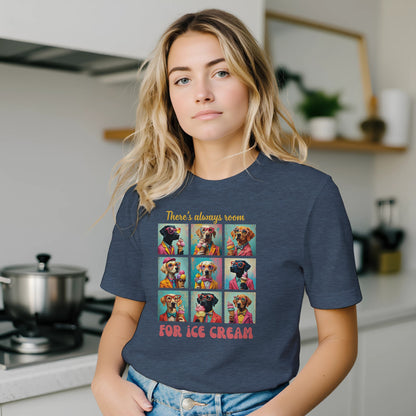 Woman wearing a dark heather blue t-shirt with a colorful graphic and text in a kitchen.