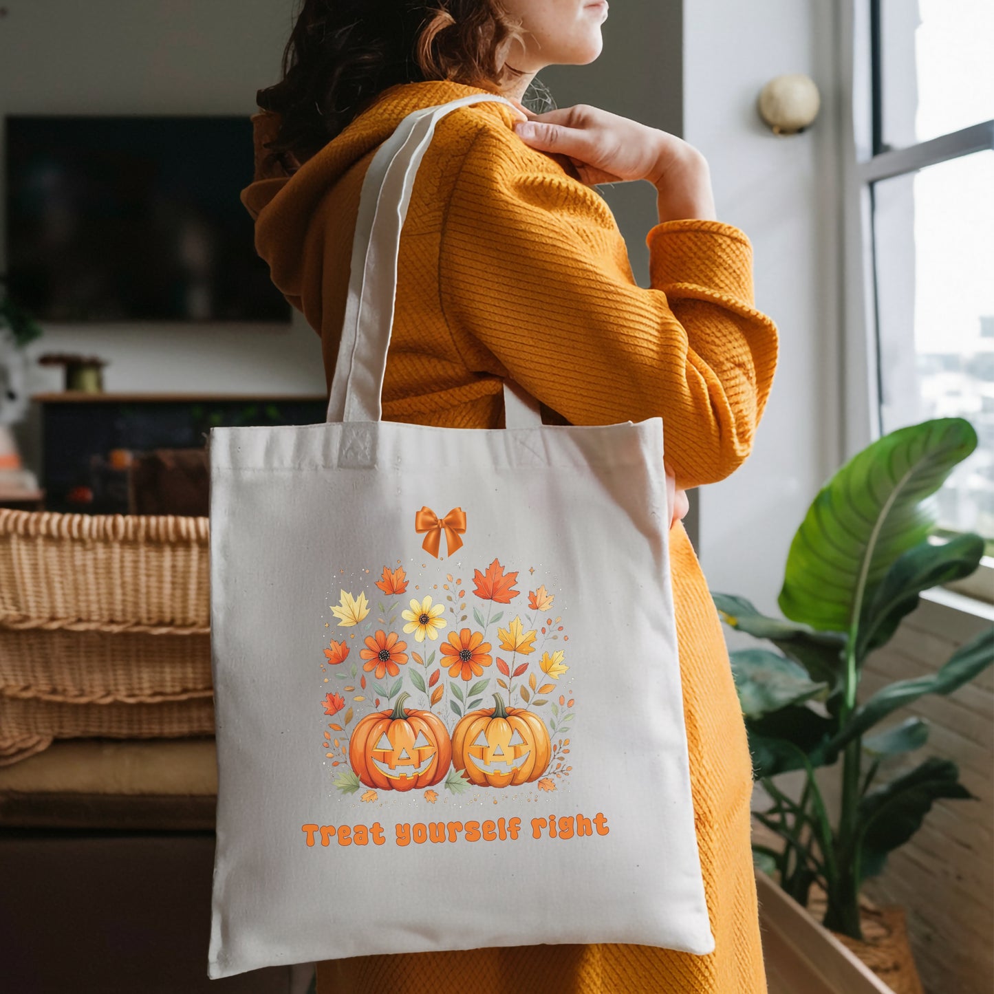 Person wearing a reusable cotton tote bag with an Orange vintage Halloween-themed design and text standing looking out a window.