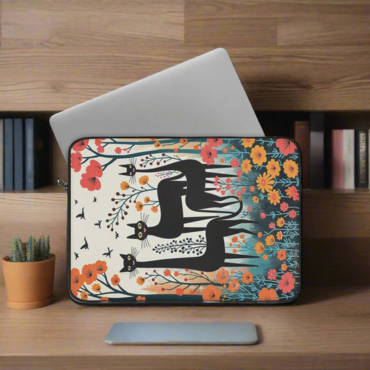 Laptop case with three black cats staanding in spring flowers laptop out