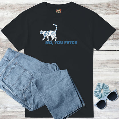 Black toile de jouy cottagecore blue and white flowers on a cat t-shirt with witty 'NO, YOU FETCH' text, and outfit suggestion - blue jeans, sunglasses, and scrunchie on a wooden surface.