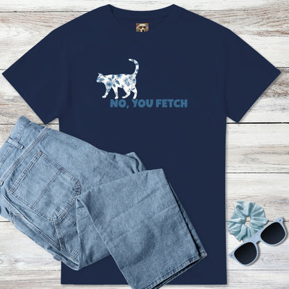 Navy blue t-shirt with a blue and white French floral cat graphic above humourous, witty text, 'No, you fetch' paired with denim jeans on a wooden surface