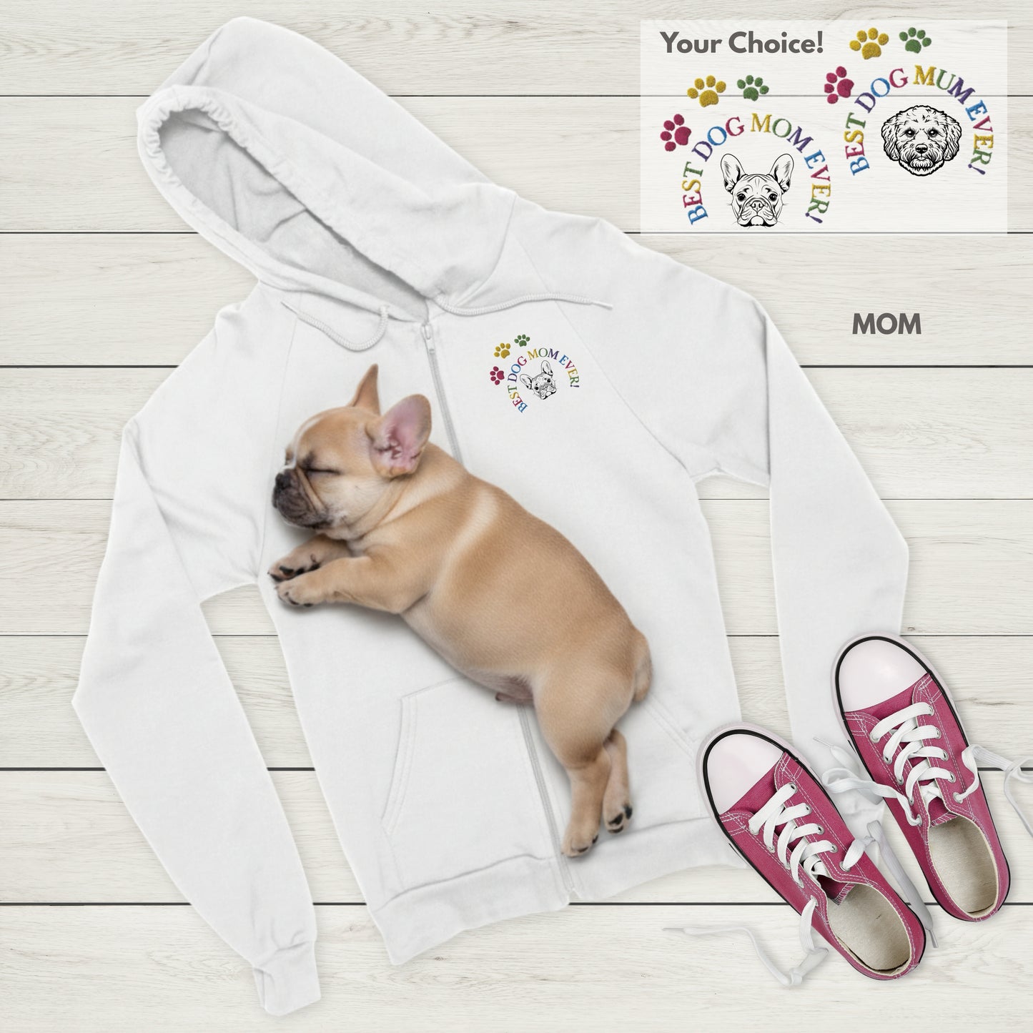 White Zip hoodie with Best Dog Mom Ever! and French Bulldog embroidery, sleeping Frenchie puppy, and red sneakers on a light wooden floor.