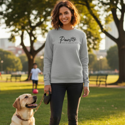 Embroidered Crew Neck Sweatshirt with custom embroidery option to add up to four names to each sleeve shown in Ash Grey on young woman enjoying a moment with her Labrador in a dog park