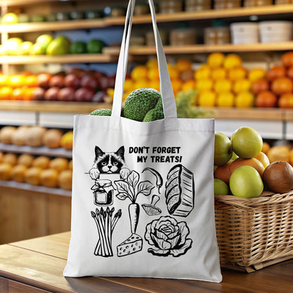 White reusable shopping tote bag with Cat peeking over groceries graphics and text in a grocery store setting