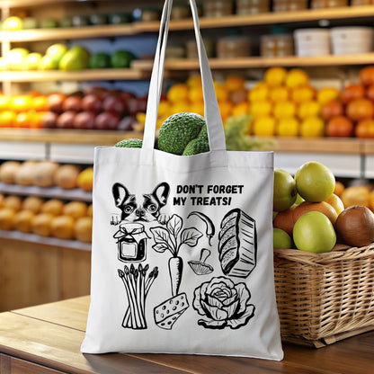 White canvas eco friendly tote bag with black illustrations of groceries and a French Bulldog and text in a grocery store setting