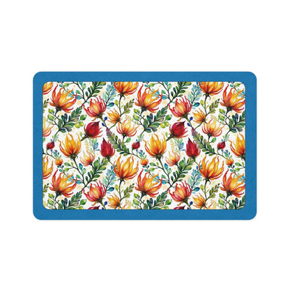 Rectangular pet bowl mat with a bright floral pattern of Australian flowers in red, yellow, and blue on a teal border.
