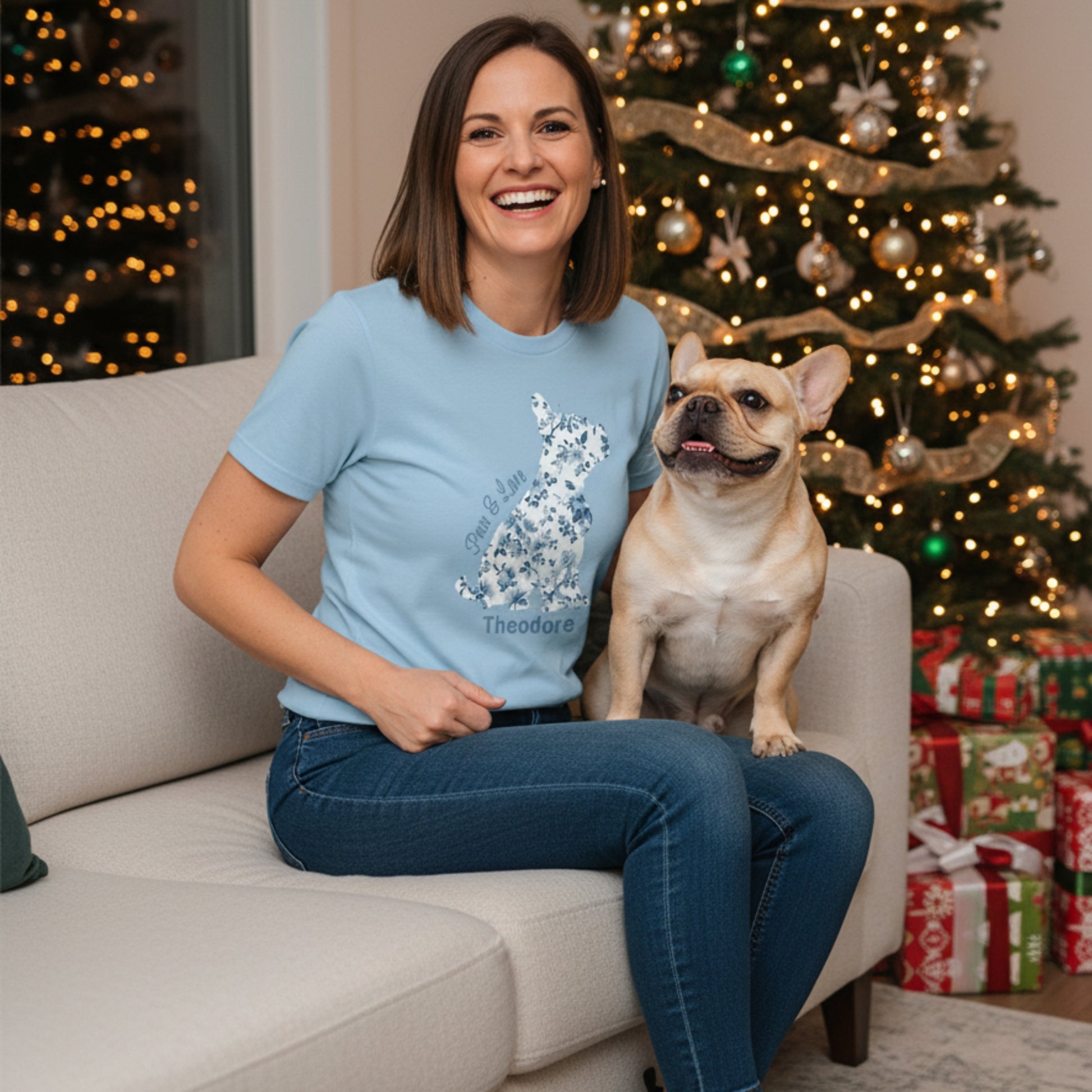 Personalised light blue Frenchie Momma tee french-tucked over jeans for a cosy Christmas at home.
