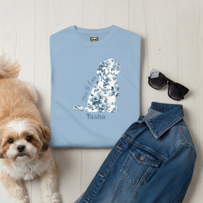Personalised Light blue t-shirt with Chinoiserie blue flora print in the shape of a Shih Tzu graphic and 'Paws & Love'  text plus dog's name with style suggestions - sunglasses, and denim jacket on a wooden surface plus a Shih Tzu.