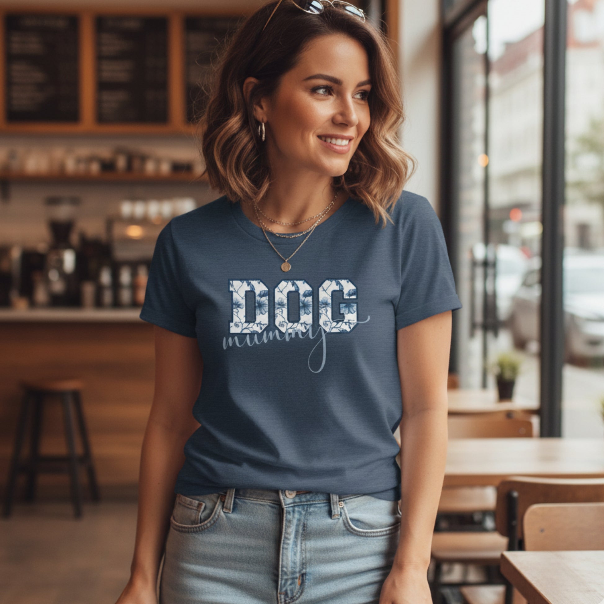 Woman wearing a blue t-shirt with 'DOG mum' text in a casual setting