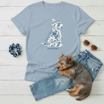 Flat lay of light blue Gildan 5000 t-shirt featuring blue Toile de Jouy Yorkshire Terrier silhouette with “Paws & Love” text; personalised Yorkie lover gift for her.